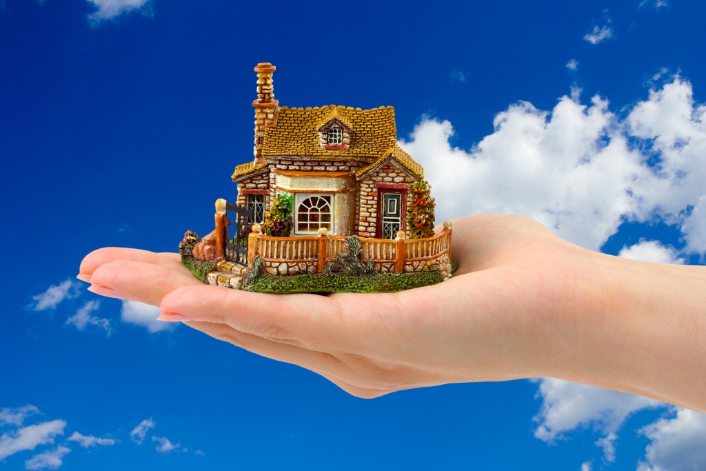 Hand And House Hand and house on a sky background
